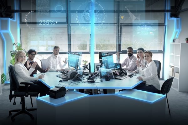 statistics-technology-people-concept-business-team-with-smartphones-computers-virtual-screens-projections-waving-hands-office (1)